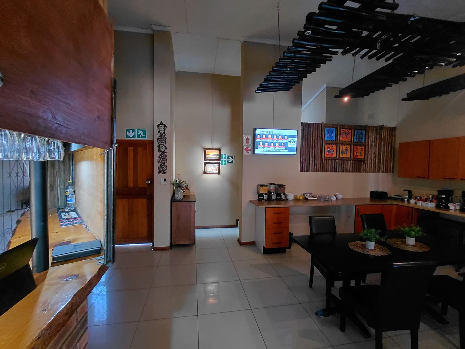 Bar counter and dining area with African artwork