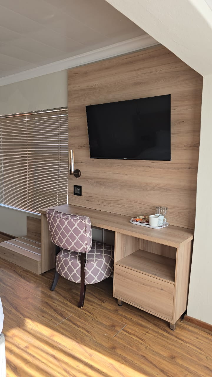 In-room workspace with mounted TV