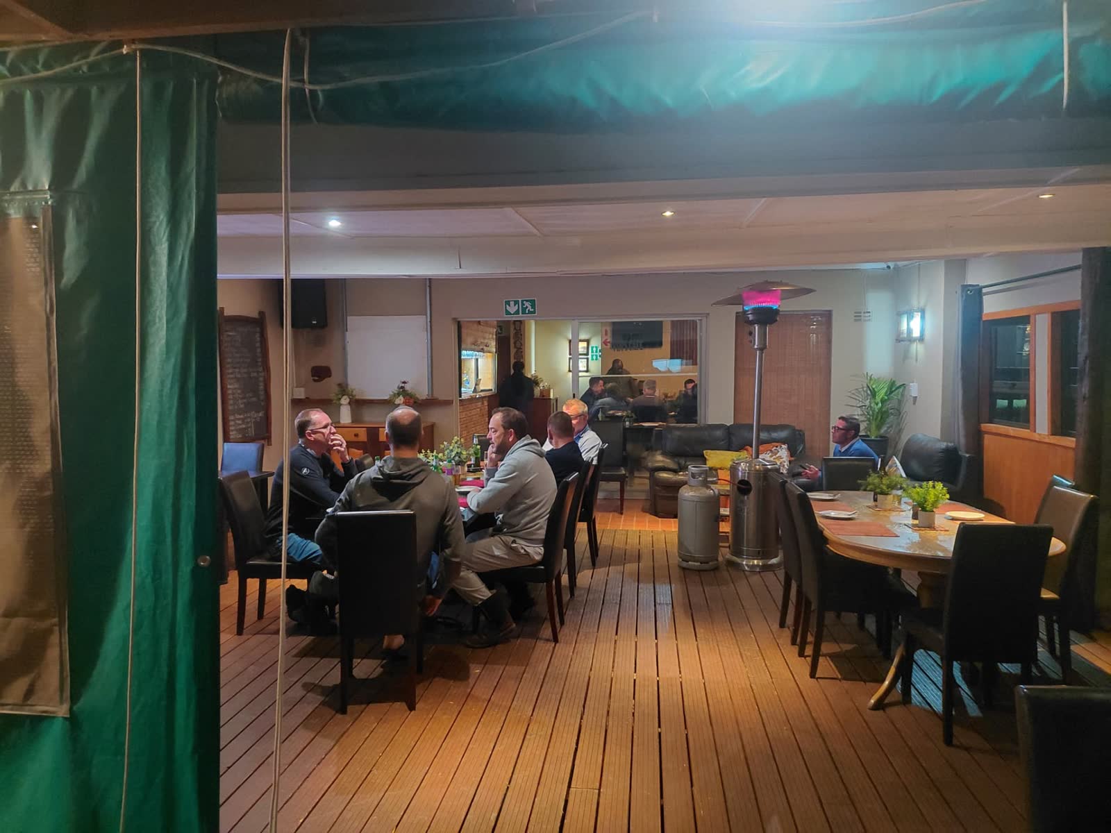 Evening on the restaurant deck with gas heaters and lounge seating