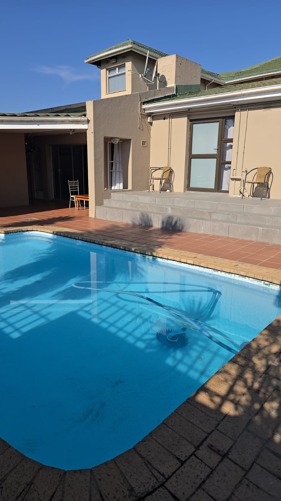 Sparkling pool with veranda and columns
