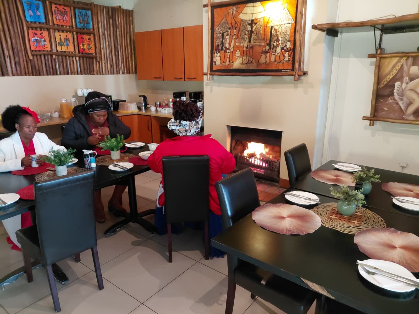 Breakfast room with open fireplace and coffee station